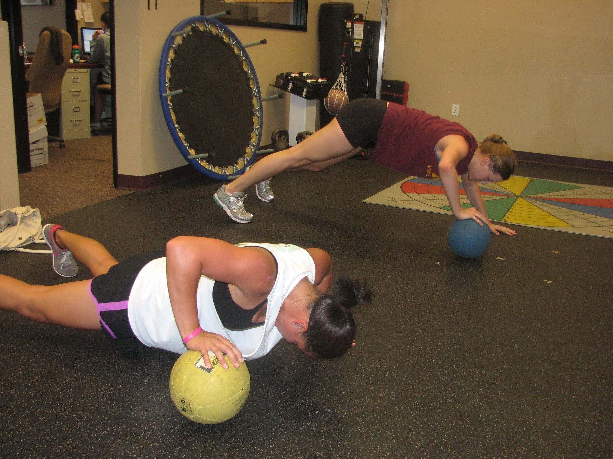 Medicine-ball push-up practice.